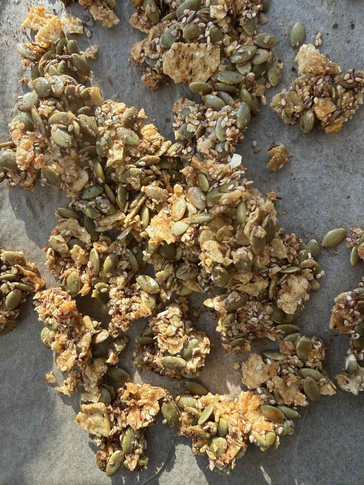 baked tortilla pepita crisp golden brown and broken into pieces.