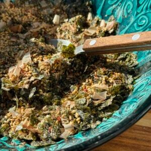 close up of bowl of homemade furikake seasoning with spoon.