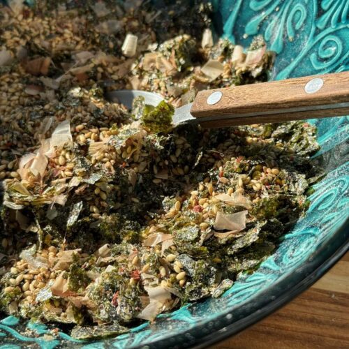 close up of bowl of homemade furikake seasoning with spoon.