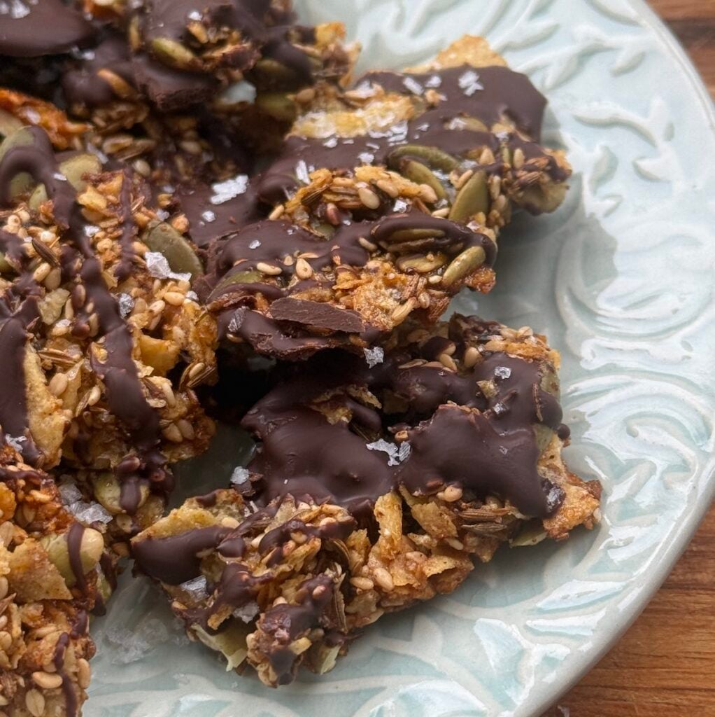 plate of seedy tortilla chocolate crunch bark.