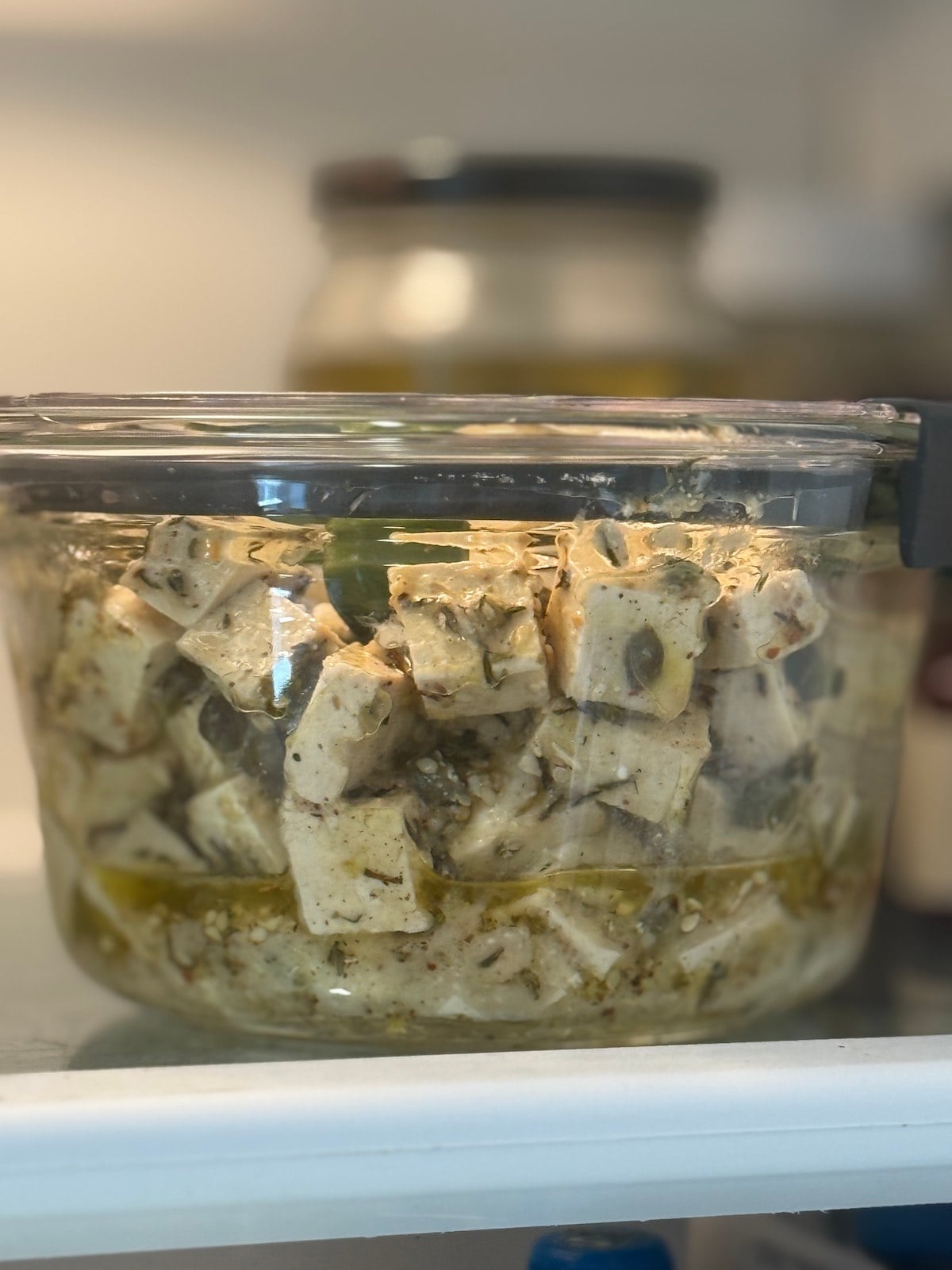 marinated tofu cubes stored in refrigerator.