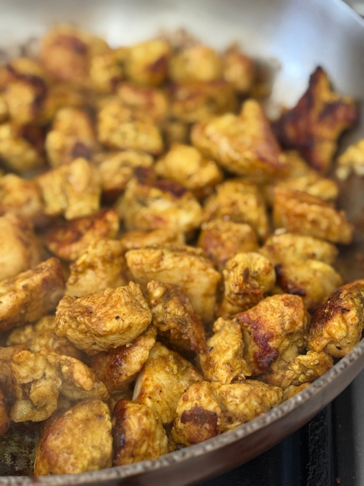 1" cubes of boneless turkey breast searing in olive oil and ghee.